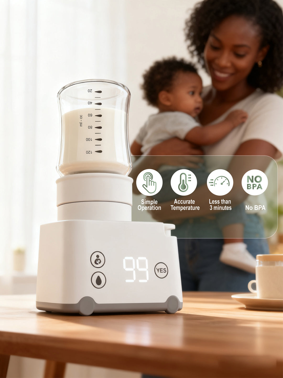 Baby bottle sterilizer on a table with a woman holding a child in the background