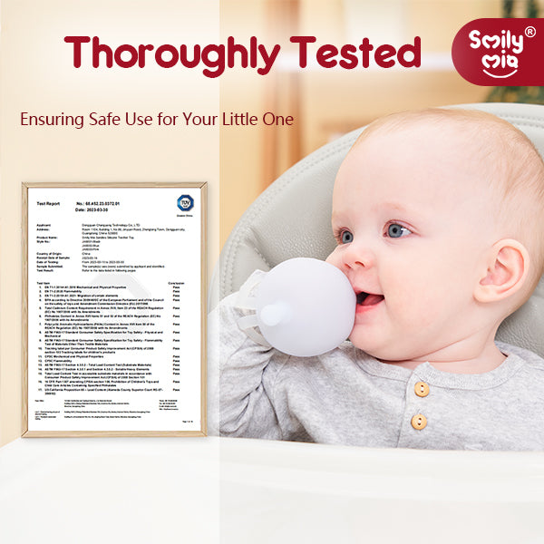 Baby holding a white ball with a test certificate on a wall, branded 'Smily Mia'.