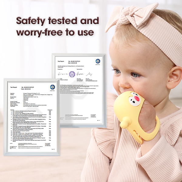 Baby wearing a yellow teething toy with safety certification documents displayed.