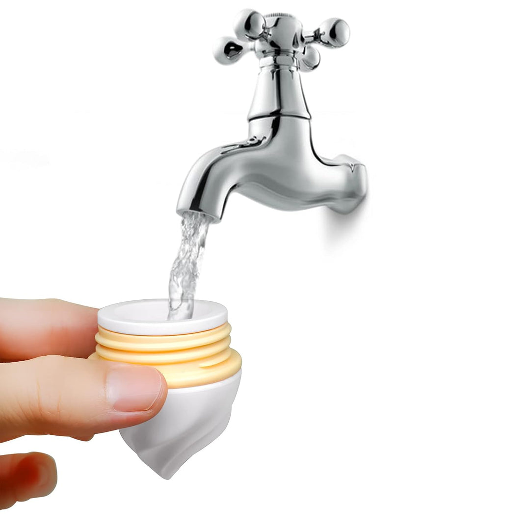 Hand holding the removable Smily Mia ice cream scoop section under running tap water showing how to fill the teether with water before freezing for cooling gum relief