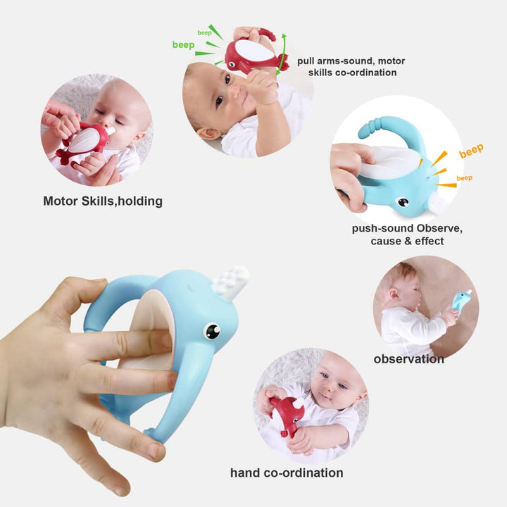 Smily Mia blue narwhal silicone teether in adult hand showing baby motor skills development, beep sound interaction, observation and hand coordination features