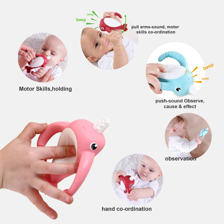 Smily Mia pink narwhal teether held in hand showing baby motor skills development, pull-arm beep sound feature, hand coordination and cause and effect learning