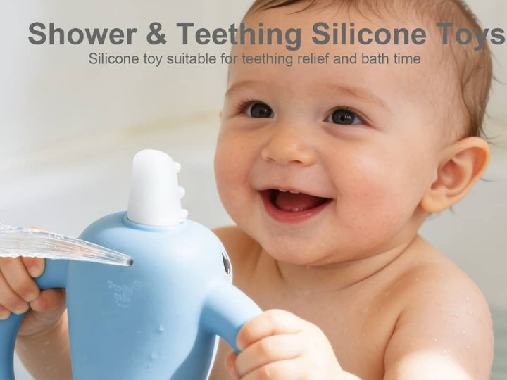Smiling baby holding Smily Mia blue narwhal silicone teething toy during bath time, showing teething relief in action