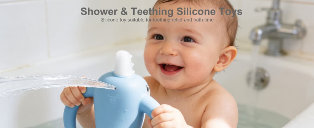 Happy baby playing with Smily Mia Nora Narwhal bath teether toy in bathtub, water spraying from silicone toy